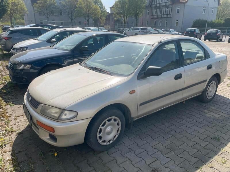 Braun Gebraucht 1995 Mazda 323 Limousine | 990 € - Bild 1/4