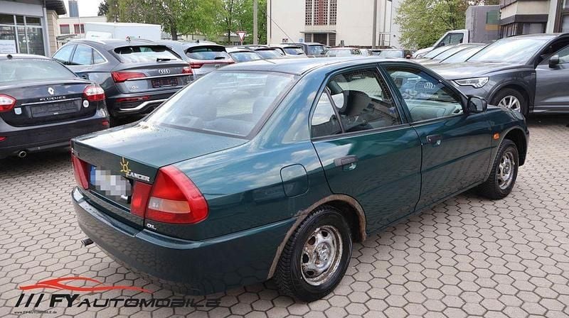 Second-hand Mitsubishi Lancer 75 CP (55 kW) 1998 Verde Berlinǎ