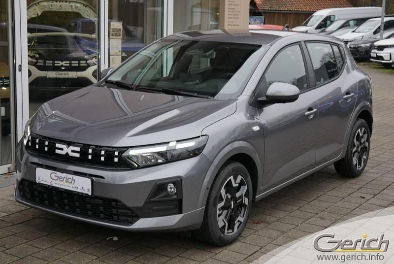 Dolomitgrau metallic Neu 2026 Dacia Sandero Journey Limousine | 19.355 € - Bild 1/4