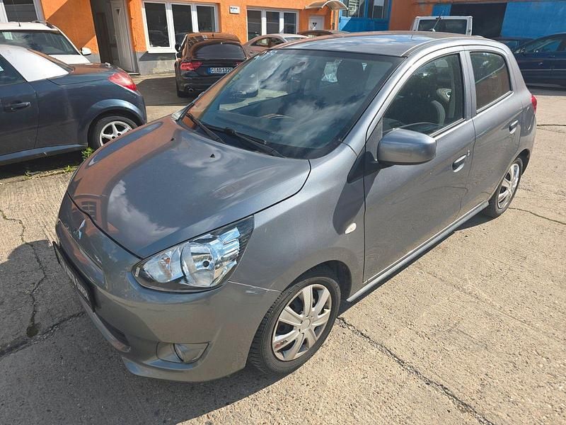 Grau Gebraucht 2015 Mitsubishi Space Star Diamant Edition Kleinwagen | 2.490 € - Bild 1/4