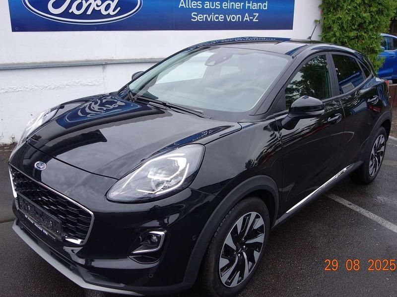 Agate black metallic Gebraucht 2024 Ford Puma Gen-E Titanium SUV | 18.800 € (Superpreis) - Bild 1/4