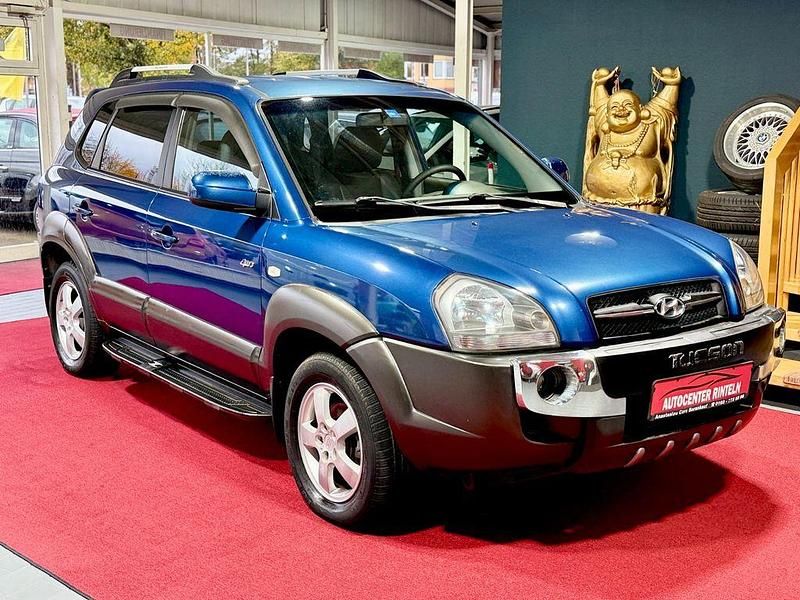 Blau Gebraucht 2006 Hyundai Tucson Team SUV | 5.490 € (Fairer Preis) - Bild 1/4