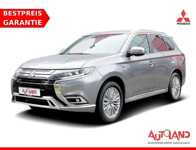 Grau Gebraucht 2021 Mitsubishi Outlander P-HEV Plus SUV | 28.990 € (Teuer) - Bild 1/4