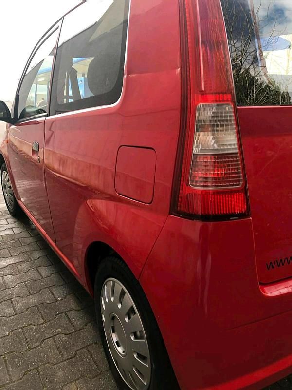 Gebraucht Daihatsu Cuore 58 PS (42 kW) 2004 Rot Kleinwagen