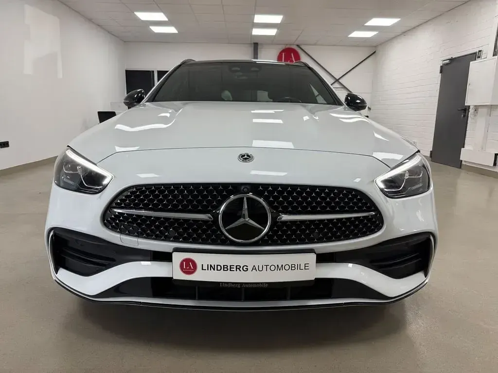 Gebraucht Mercedes C300e AMG line 313 PS (230 kW) 2022 Opalithweiss  metalliclack Kombi