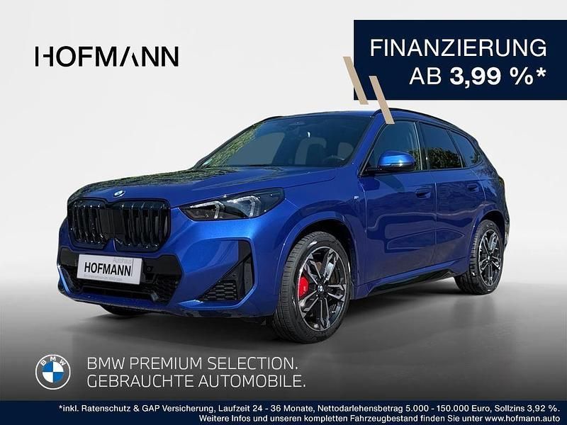 Portimao blau metallic Gebraucht 2024 BMW X1 M Sport SUV | 41.502 € (Guter Preis) - Bild 1/3