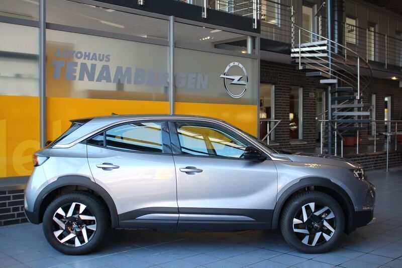 Gebraucht Opel Mokka-e Elegance 100 kW (136 PS) 2023 Kontrast grau/quarz silber SUV