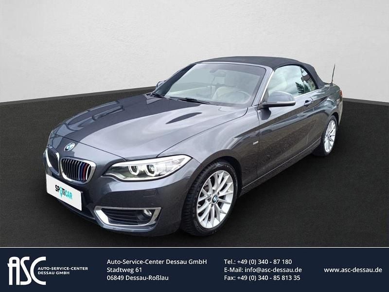 Mineralgrau metallic Gebraucht 2015 BMW 218 Luxury Line Cabrio | 17.990 € (Fairer Preis) - Bild 1/4