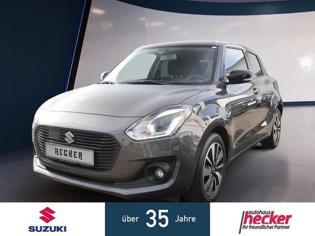 Grau Gebraucht 2017 Suzuki Swift Comfort+ Kleinwagen | 12.970 € (Fairer Preis) - Bild 1/4