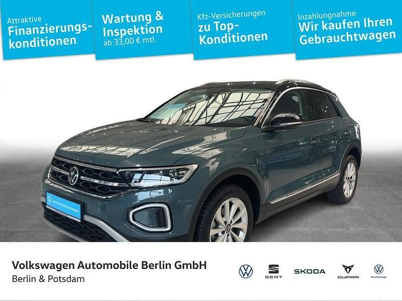 Petroleum blue metallic/schwar Gebraucht 2024 VW T-Roc Style SUV | 29.990 € (Fairer Preis) - Bild 1/4