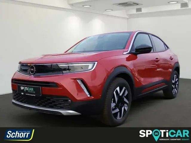 Kosmos rot (metallic Gebraucht 2023 Opel Mokka-e Elegance SUV | 23.900 € (Fairer Preis) - Bild 1/4
