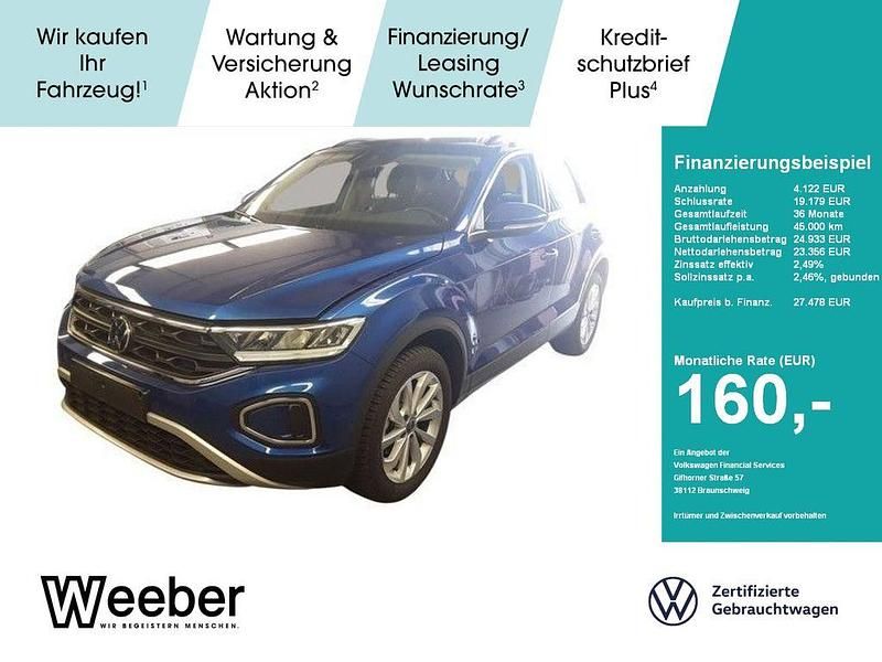 Ravennablau (metallic) Gebraucht 2024 VW T-Roc Life SUV | 27.478 € (Fairer Preis) - Bild 1/4