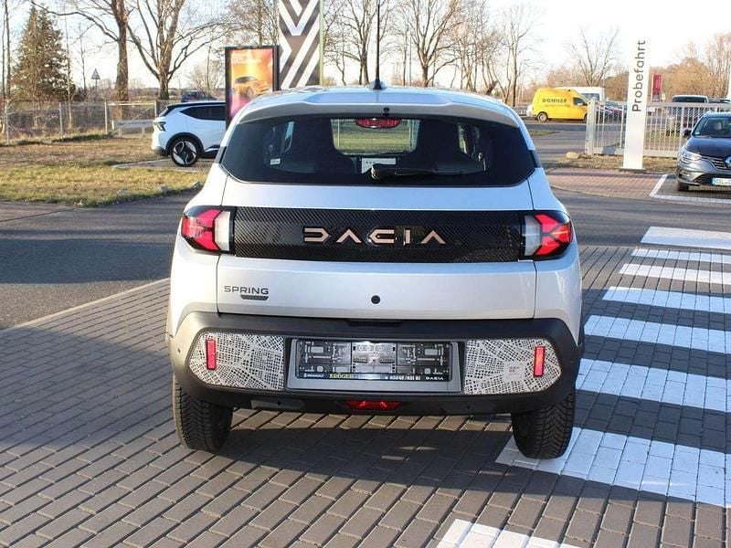 Gebraucht Dacia Spring Extreme 47 kW (65 PS) 2024 Diamantsilbergrau Kleinwagen
