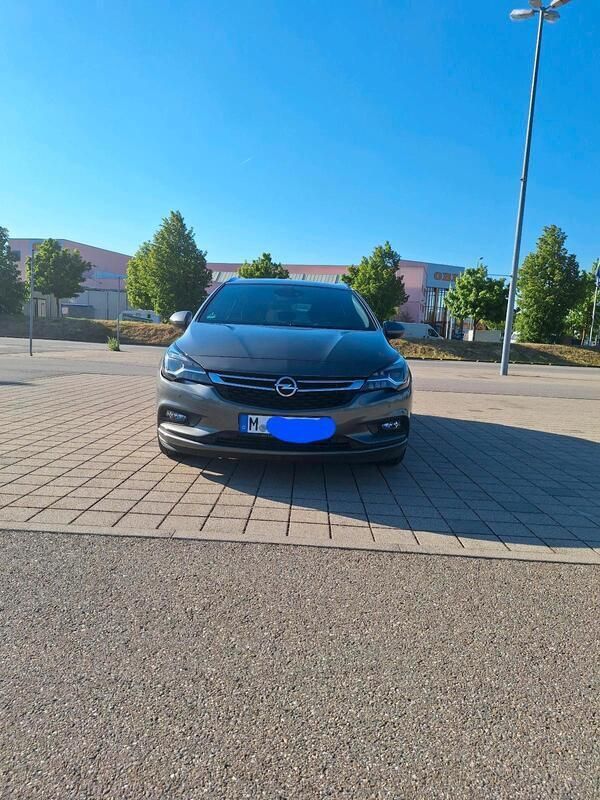 Grau Gebraucht 2017 Opel Astra Kombi | 10.599 € (Fairer Preis) - Bild 1/4