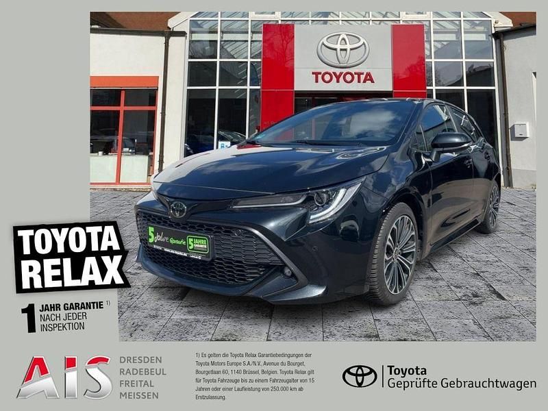 Black mica / ink Gebraucht 2021 Toyota Corolla Team Limousine | 16.480 € (Fairer Preis) - Bild 1/3