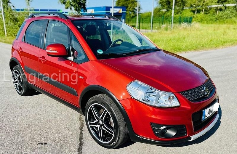 Orange Gebraucht 2011 Suzuki SX4 SUV | 8.695 € (Teuer) - Bild 1/4