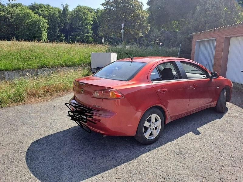 Gebraucht Mitsubishi Lancer 117 PS (86 kW) 2010 Rot Limousine