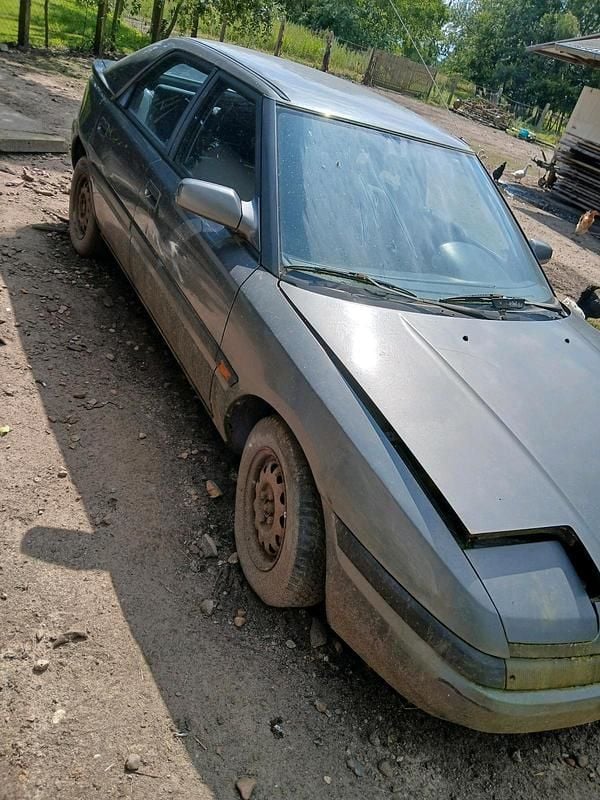 Grau Gebraucht 1992 Mazda 323F Limousine | 800 € - Bild 1/4
