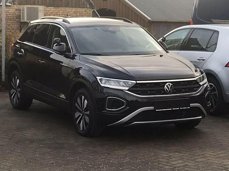 Deep black perleffekt (metallic) Gebraucht 2023 VW T-Roc Move SUV | 26.600 € (Fairer Preis) - Bild 1/4