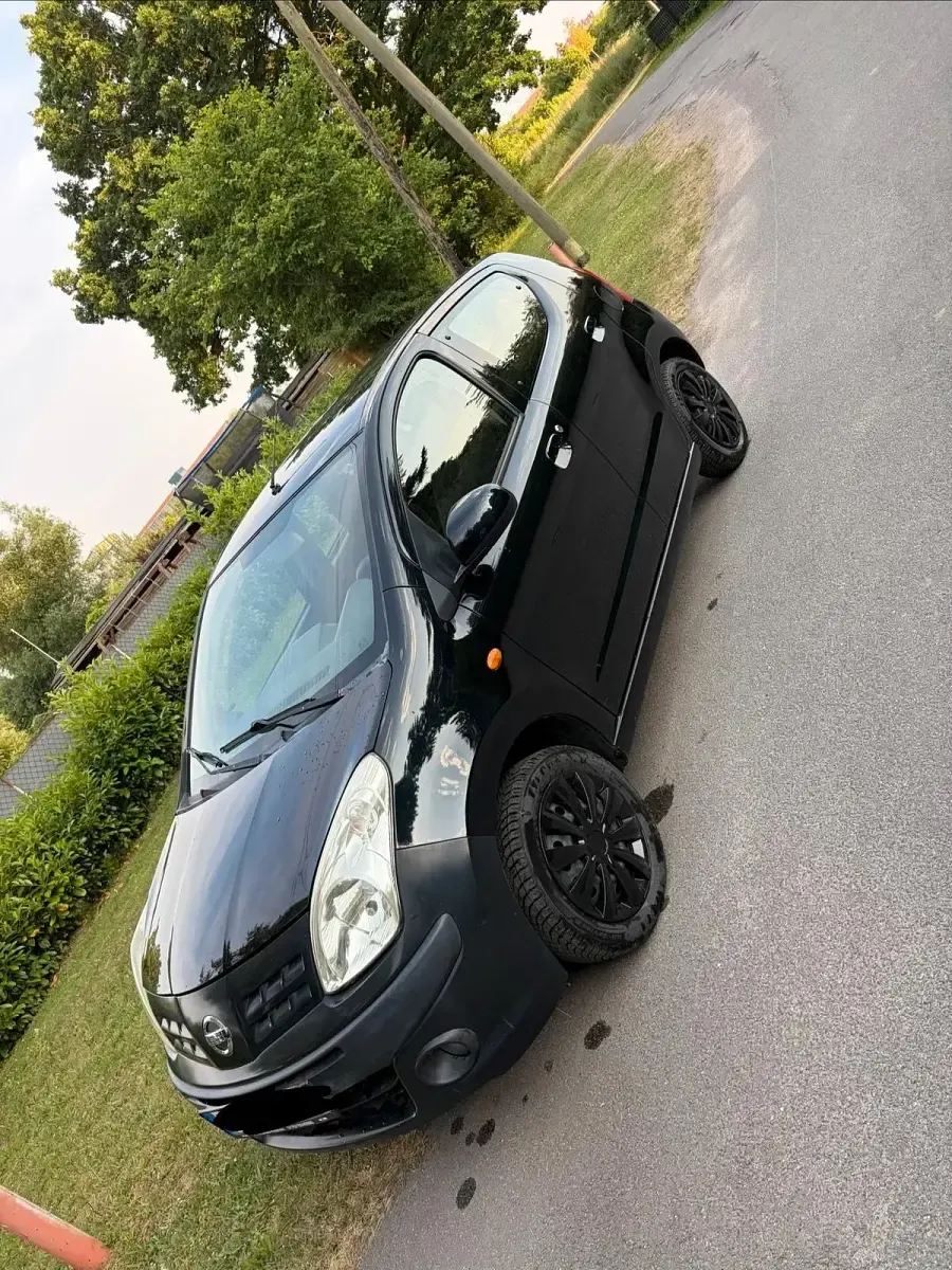 Gebraucht Nissan Pixo 63 PS (46 kW) 2011 Schwarz Kleinwagen