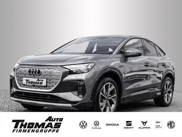 Grau Gebraucht 2022 Audi Q4 Sportback e-tron Sport SUV | 30.799 € (Fairer Preis) - Bild 1/3