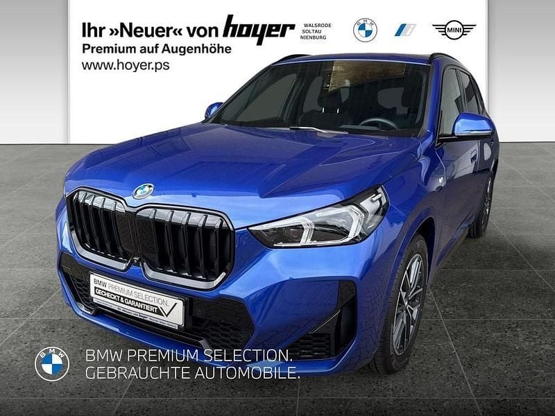 M portimao blau (metallic) Gebraucht 2024 BMW X1 M Sport SUV | 50.730 € - Bild 1/4