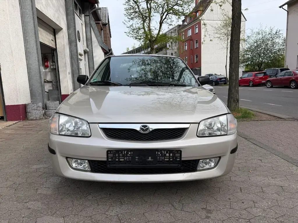 Second-hand Mazda 323 88 CP (64 kW) 1999 Gri Berlinǎ