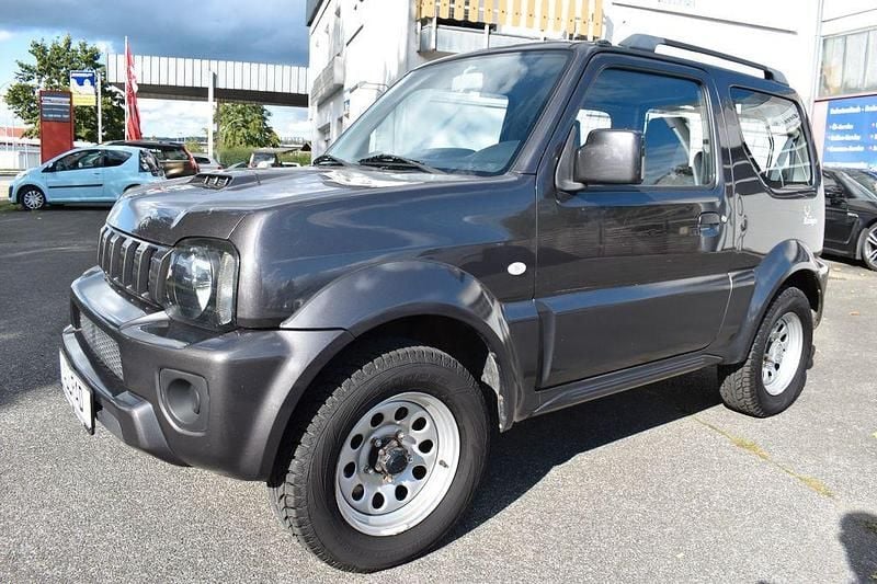 Grau Gebraucht 2014 Suzuki Jimny Ranger SUV | 12.450 € (Fairer Preis) - Bild 1/4