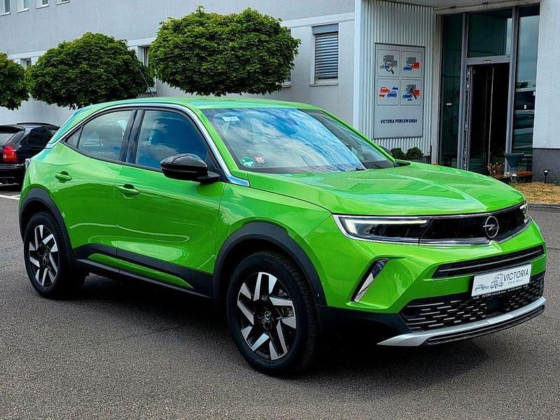 Grün Gebraucht 2023 Opel Mokka-e Elegance SUV | 17.250 € (Superpreis) - Bild 1/4