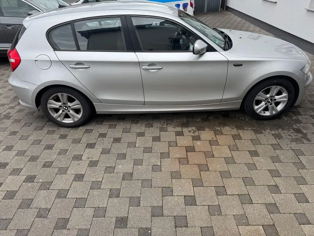 Używany BMW 116 122 KM (89 kW) 2010 Srebrny Hatchback