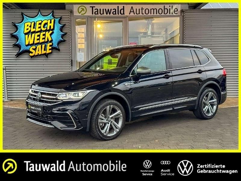 Schwarz (deep black perleffekt) Gebraucht 2024 VW Tiguan Allspace R-line SUV | 39.430 € (Fairer Preis) - Bild 1/4