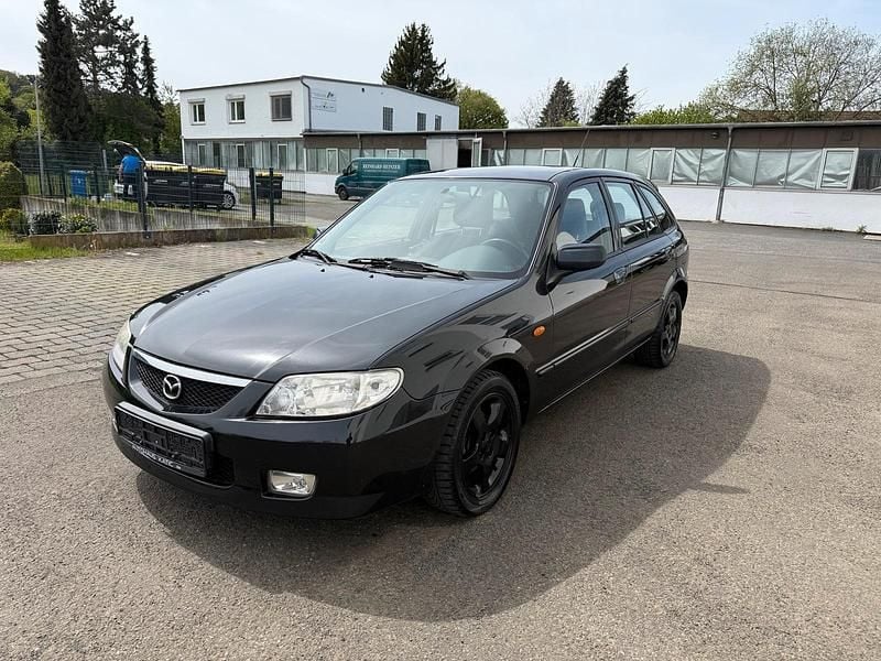 Second-hand Mazda 323F 98 CP (72 kW) 2002 Negru Berlinǎ