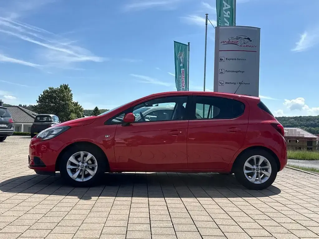 Używany Opel Corsa drive 90 KM (66 kW) 2016 Czerwony Hatchback