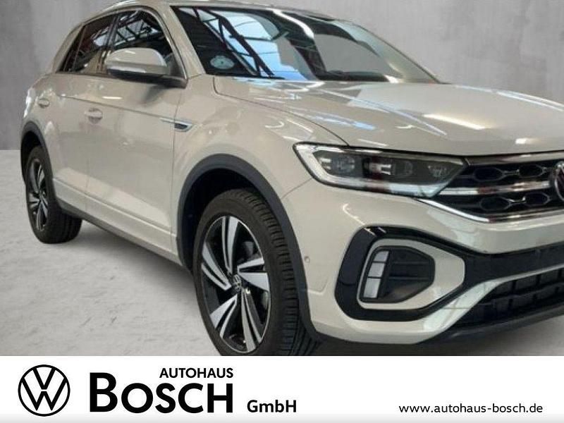 Ascotgrau Gebraucht 2024 VW T-Roc R-line SUV | 28.290 € (Superpreis) - Bild 1/4