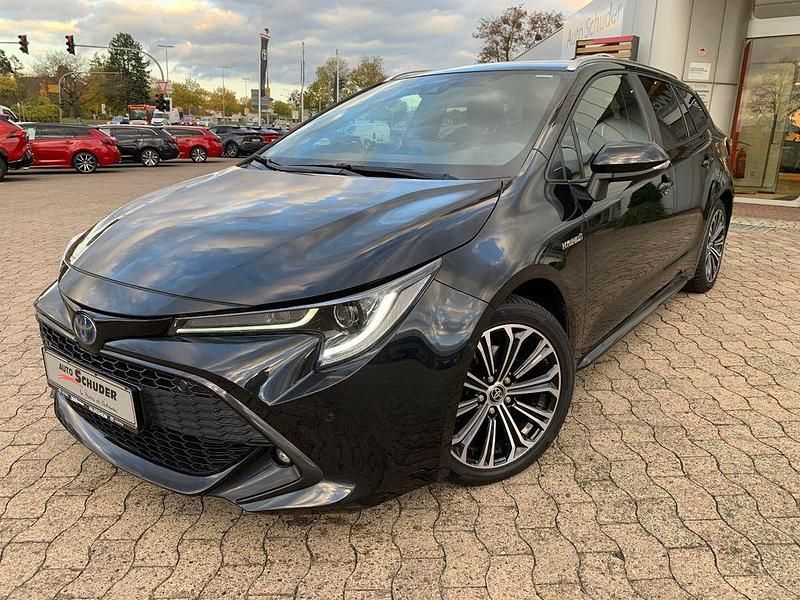 Mysticschwarz mica Gebraucht 2021 Toyota Corolla Team Kombi | 22.990 € (Fairer Preis) - Bild 1/4