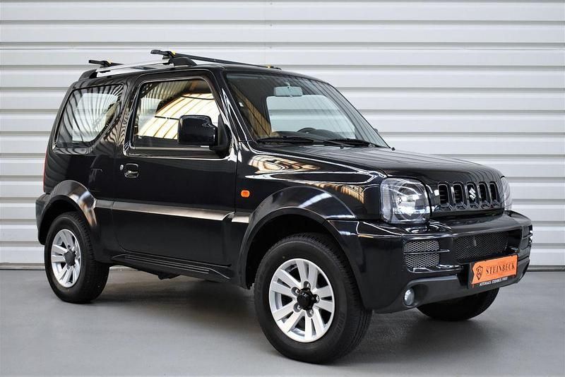 Schwarz Gebraucht 2012 Suzuki Jimny Club SUV | 15.990 € (Teuer) - Bild 1/4
