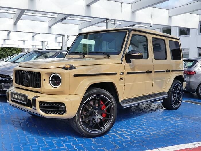 Manufaktur wüstensand uni Gebraucht 2024 Mercedes G63 AMG AMG SUV | 189.890 € (Superpreis) - Bild 1/4