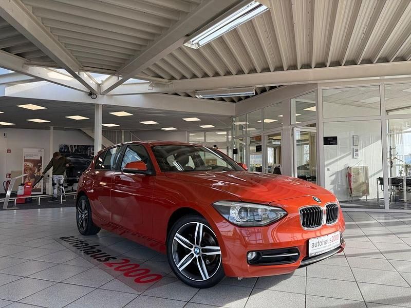 Orange Gebraucht 2013 BMW 116 Sport Line Kleinwagen | 8.950 € (Fairer Preis) - Bild 1/4