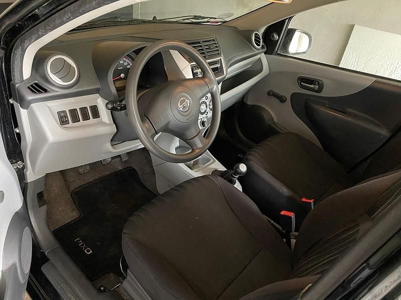 Gebraucht Nissan Pixo 68 PS (50 kW) 2011 Schwarz Kleinwagen