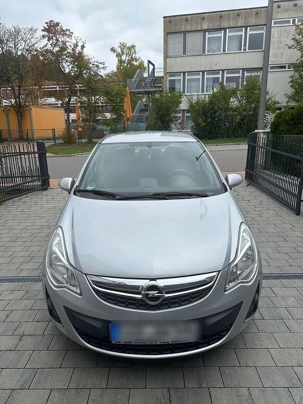 Grau Gebraucht 2013 Opel Corsa Edition Kleinwagen | 6.600 € (Teuer) - Bild 1/4