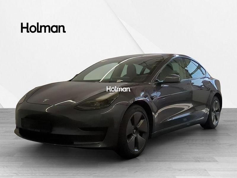 Grau Gebraucht 2021 Tesla Model 3 Standard Range Plus Limousine | 21.337 € (Fairer Preis) - Bild 1/4