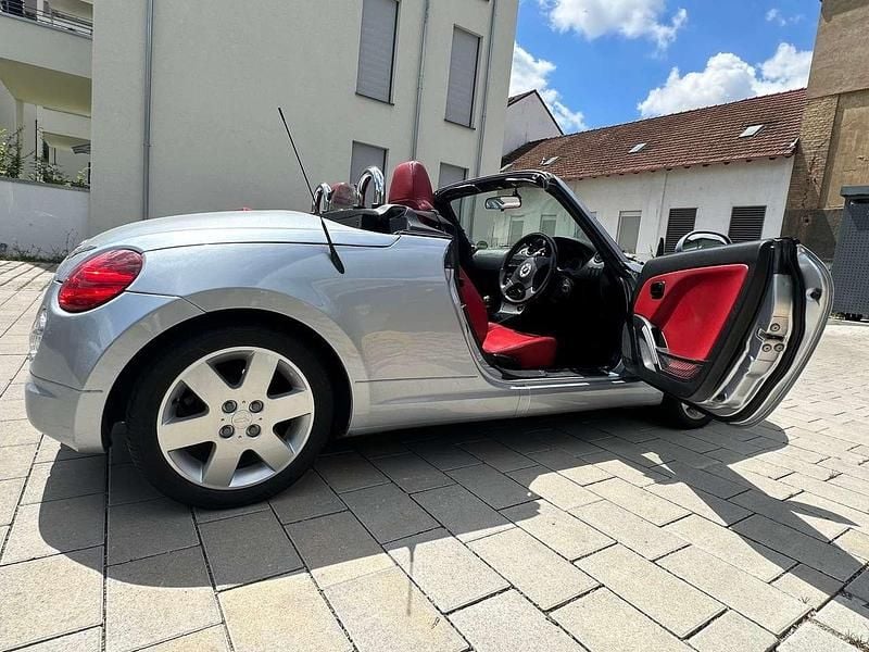 Silber Gebraucht 2004 Daihatsu Copen Cabrio | 8.500 € - Bild 1/4