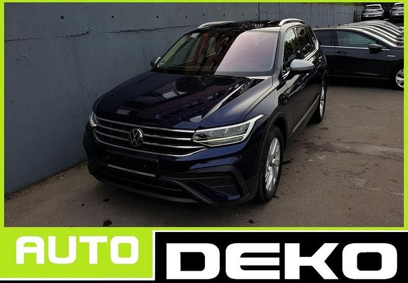 Atlantic blue metallic Gebraucht 2024 VW Tiguan Allspace SUV | 31.470 € (Superpreis) - Bild 1/4