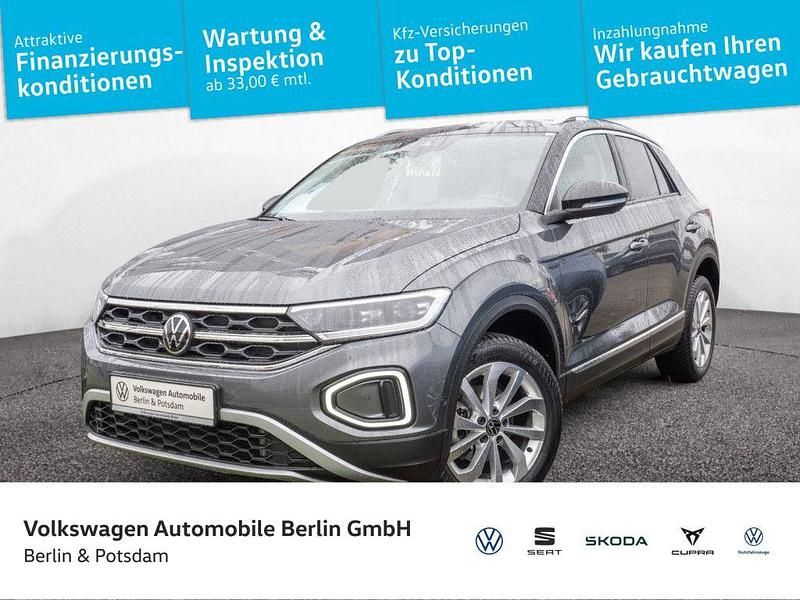 Indiumgrau metallic/schwarz Gebraucht 2024 VW T-Roc Style SUV | 29.990 € (Fairer Preis) - Bild 1/4