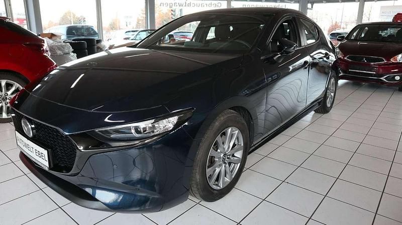 Deep crystal blue Gebraucht 2019 Mazda 3 Limousine | 18.410 € (Fairer Preis) - Bild 1/4