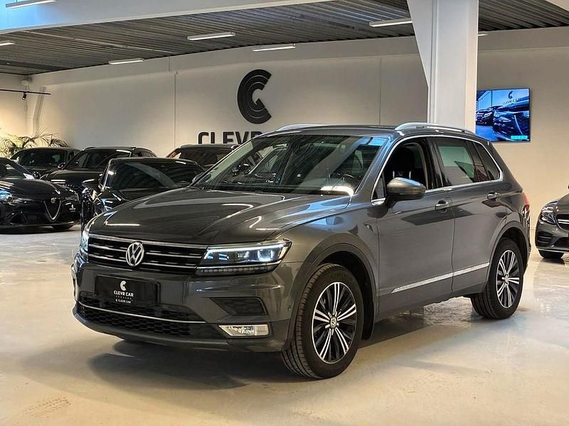 Grau Gebraucht 2016 VW Tiguan Highline SUV | 18.738 € (Fairer Preis) - Bild 1/4