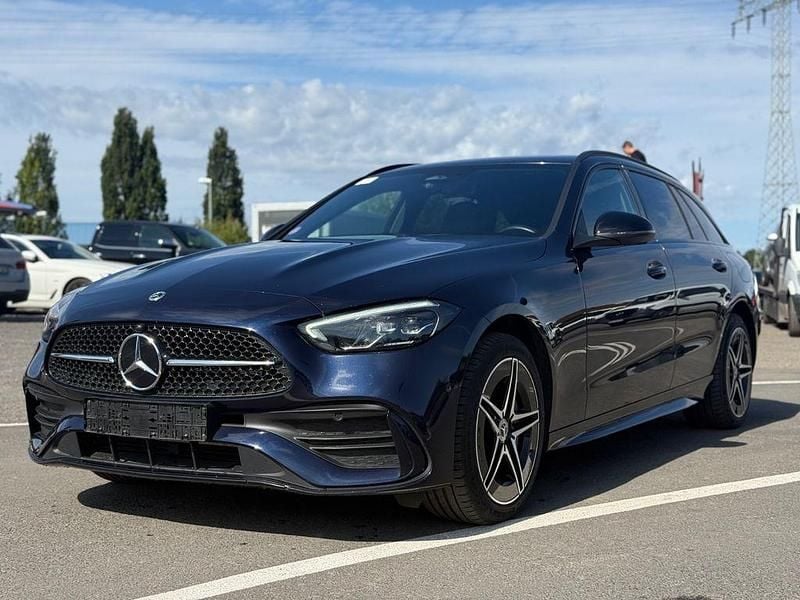 Blau Gebraucht 2022 Mercedes C300e AMG line Limousine | 25.900 € (Teuer) - Bild 1/4