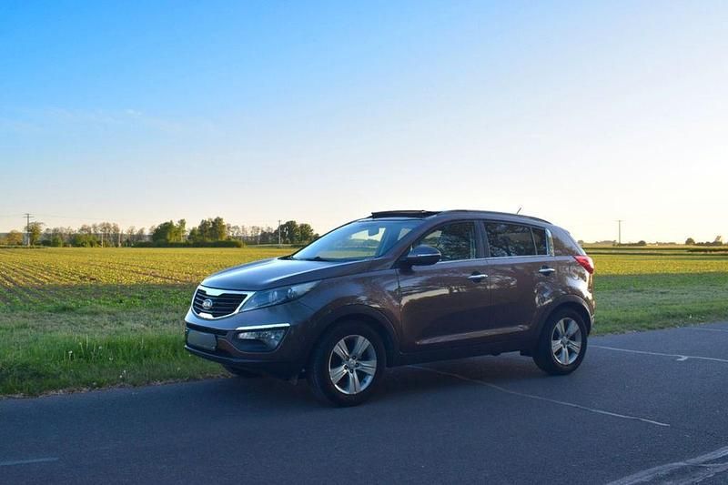 Braun Gebraucht 2012 Kia Sportage Vision SUV | 7.150 € (Guter Preis) - Bild 1/4