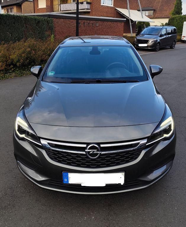 Grau Gebraucht 2018 Opel Astra Eco Kombi | 8.799 € (Fairer Preis) - Bild 1/4