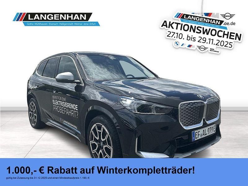 Schwarz Gebraucht 2024 BMW iX1 Luxury Line SUV | 43.810 € (Fairer Preis) - Bild 1/4